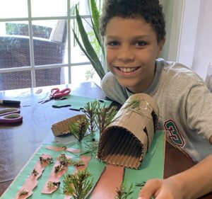 Student displays Powhatan diorama.