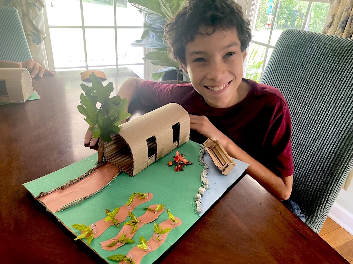 Student displays Powhatan longhouse diorama